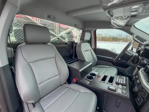 Front passenger seat and console from passenger-side angle.